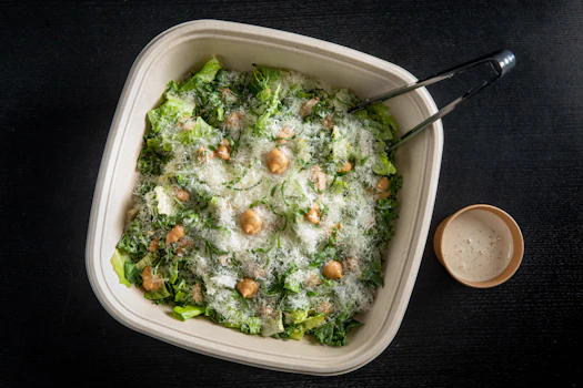 Photo of Tray of Honey-Garlic Caesar Salad