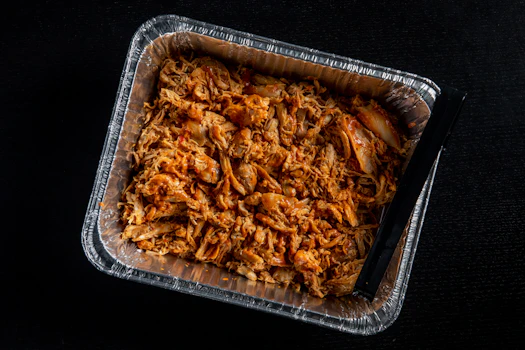Photo of Tray of Fire-Grilled Pulled Chicken