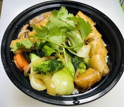 Photo of Vegan Stir Fried Veggies, Tofu, and Veggie Egg Rolls Vermicelli Bowl