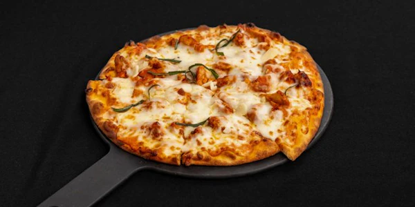 Photo of 9" Butter Chicken Naan Pizza