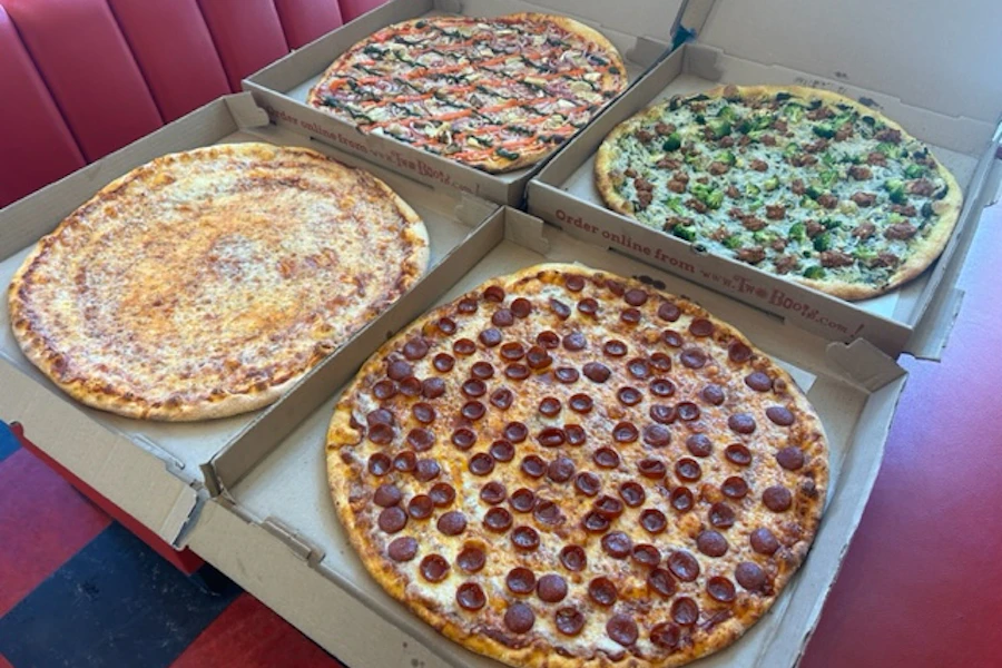 Two Boots Manhattan Corporate Catering and Group Ordering located in New York City. Two Boots Manhattan's top menu items include Family Size Order of House Salad with Balsamic Vinaigrette, Family size order of Caesar Salad with Caesar Dressing, Dozen of Garlic Knots.