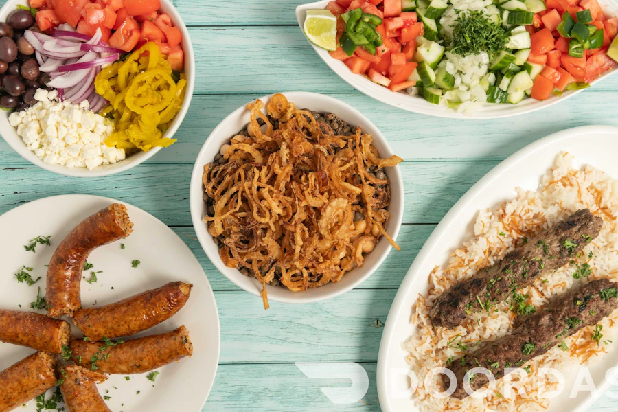 King of Koshary Corporate Catering and Group Ordering located at 5515 Wilson Blvd, Arlington, VA 22205, USA. King of Koshary's top menu items include Platter of Mediterranean Mezze, Platter of Falafel, Tray of Baklava.