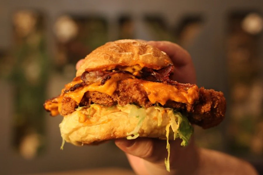 Holy Burger Corporate Catering and Group Ordering located at 24009 Linden Blvd, Elmont, NY 11003, USA. Holy Burger's top menu items include Seasoned Fries by the Box, Regular Chicken Nuggets by the Box, Chocolate Chip Cookie.