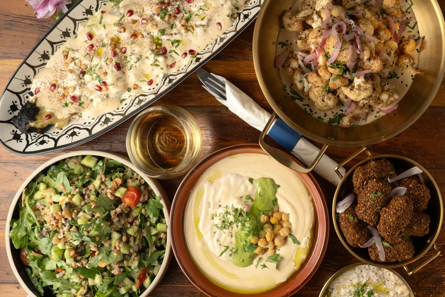 Hummus Kitchen Corporate Catering and Group Ordering located at 1613 2nd Ave, New York, NY 10075, USA. Hummus Kitchen's top menu items include Full Tray of Whole Charred Eggplant, Full Tray of Chicken Shawarma, Full Tray of Cauliflower.