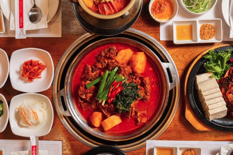 The Kunjip Corporate Catering and Group Ordering located at 32 W 32nd St, New York, NY 10001, USA. The Kunjip's top menu items include Beef Bulgogi Dosirak, Sweet & Spicy Chicken Dosirak, Bulgogi Bibimbap.