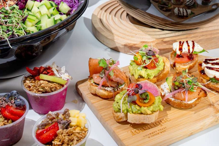 Toastique Corporate Catering and Group Ordering located at 445 5th Ave, New York, NY 10016, USA. Toastique's top menu items include Dozen of Smoked Salmon Mini Toasts, Dozen of Avocado Smash Mini Toasts, Dozen of OG Acai Mini Bowls.